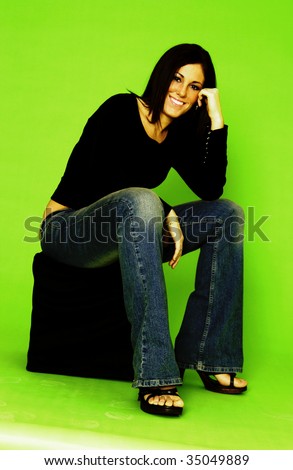 young woman sitting on stool
