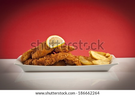Viener chicken fries, breaded steak with french fries and lemon