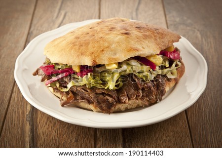 Doner Kebab - grilled meat, bread and vegetables shawarma sandwich