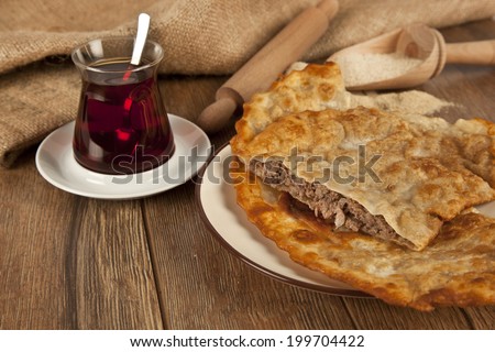 Turkish meat pie fried in oil ( Cig borek ) ( Raw pie or Tatar pie )