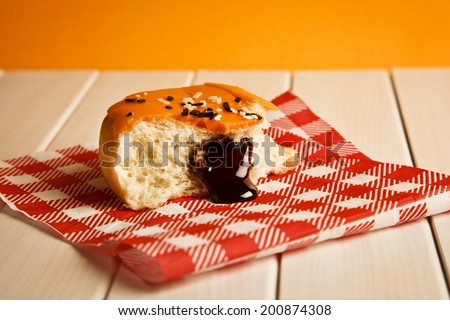 Glazed caramel Donut with Bite Missing
