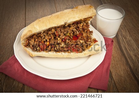 Turkish Kokorec - lamb intestine food sandwich with ayran