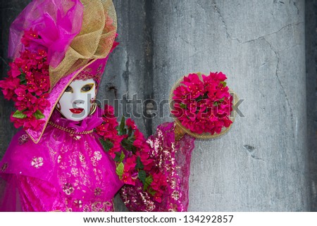 VENICE - FEB 9: An unidentified masked person in costume in St. Mark's Square during the Carnival of Venice on February 9, 2013. The 2013  carnival was held from January 26 Th to February 12 Th.