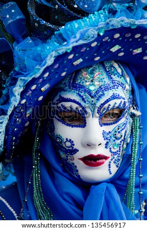 VENICE - FEB 9: An unidentified masked person in costume in St. Mark\'s Square during the Carnival of Venice on February 9, 2013. The 2013 carnival was held from January 26 Th to February 12 Th