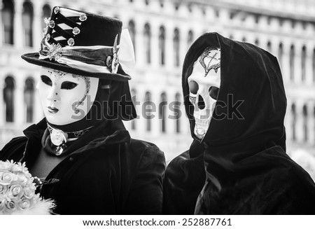 VENICE - FEB 13, 2015: An unidentified masked person in costume in St. Mark's Square during the Carnival of Venice on February 13, 2015. The 2015 carnival was held from February 7 Th to February 17Th
