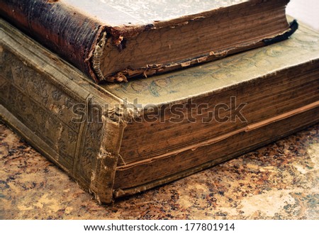 Old antique  books with worn binding and small spots of time