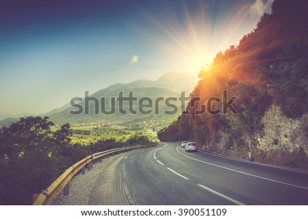 View of the road bend and a mountain range near Budva, Montenegro. Balkans, Adriatic sea, Europe.