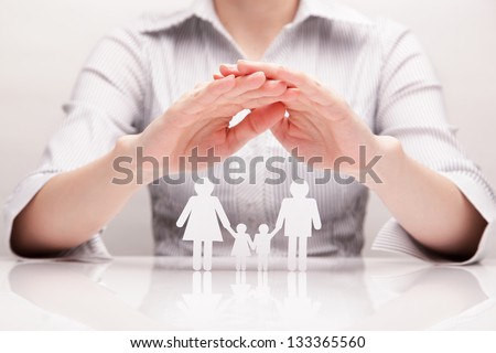 Hands hug the family (concept)
