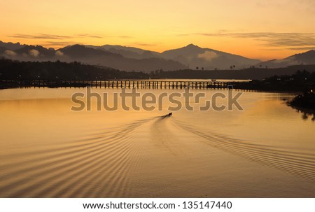 A boat and water flow line in the morning, Thailand