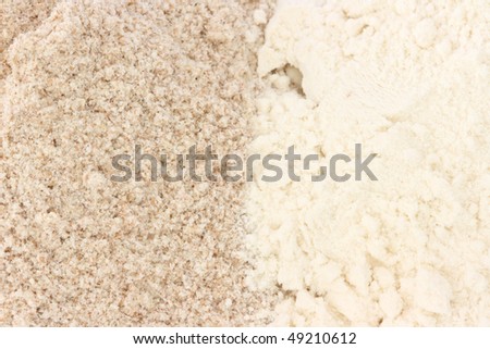 Close up view of two types of flour - whole grain / wholemeal and smooth