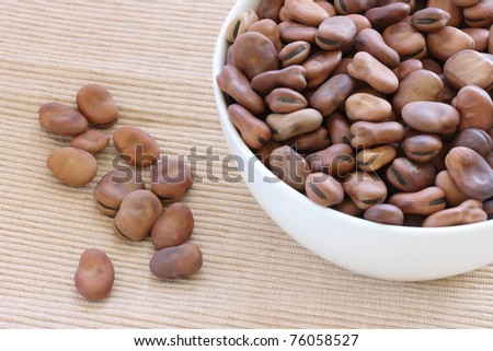 View of dry brown beans in bowl