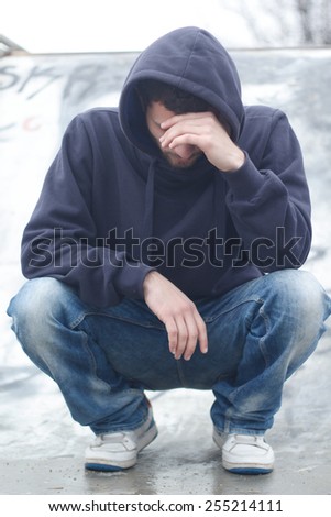 Depressed man with hood