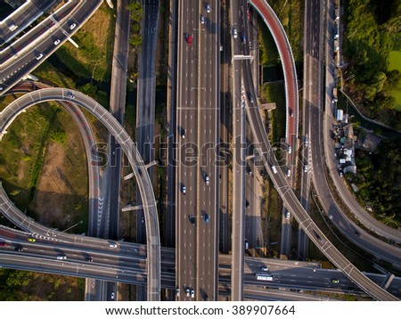 Aerial view above the inter-city expressway and ring road systems on the outer edge of Bangkok Metropolitan.