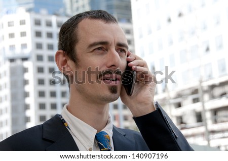 Business Man Speaking on Smart Phone