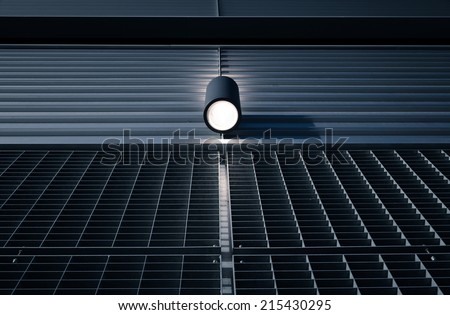 Spotlight lighting sorrounding walls of a warehouse