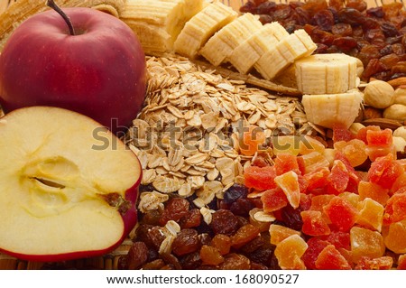 oatmeal with apples, bananas, raisins, candied fruit and nuts