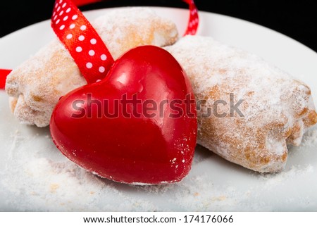 red heart with cookies in powdered sugar