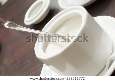 white sugar in the sugar bowl on the table