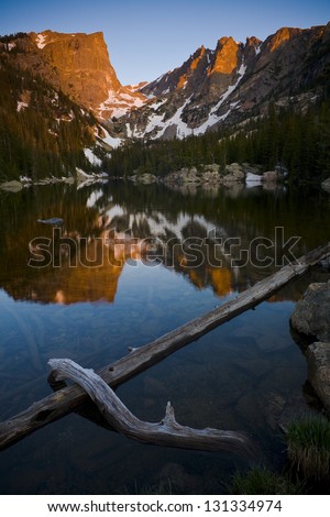 Sunrise, Dream Lake. The warm morning sun lights Hallett Peak and is reflected in the calm waters of Dream Lake in Rocky Mountain National Park.