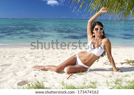 the beautiful sexy girl in white bikini on a beach