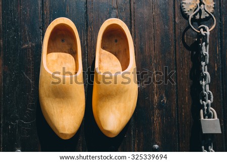 Designer mailbox in a shoe. knocker and wooden shoes