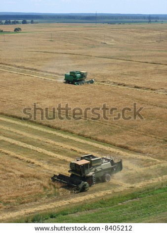 End of summer is busy time for farmers. This combine is reaping rye.