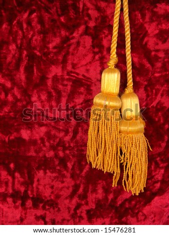 Red velvet with two golden tassels.