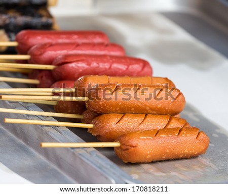 Hotdog placed in trays for sale on the market.