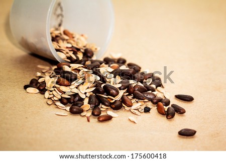 Seeds placed on brown paper background.