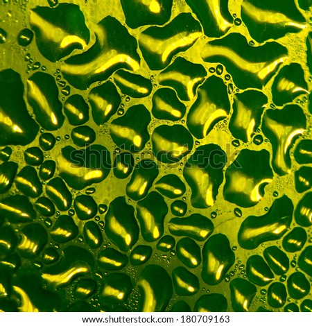 Drops of water in plastic bottles green.