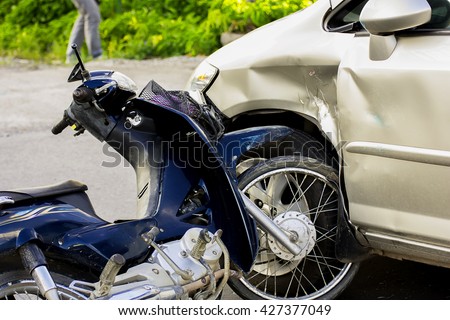 Motorcycle accident with a car.