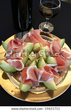 Prosciutto ham, Cantaloupe melon and red wine