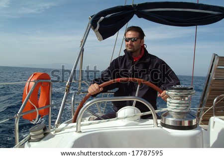 Skipper driving a sailboat