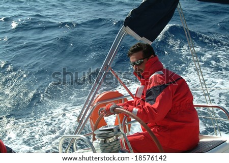 The skipper  driving a sailboat