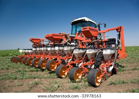 Red big harvest machine on sugar beet