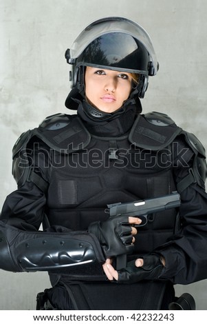 Beautiful Woman, Police Officer in complete intervention equipment ready to action.