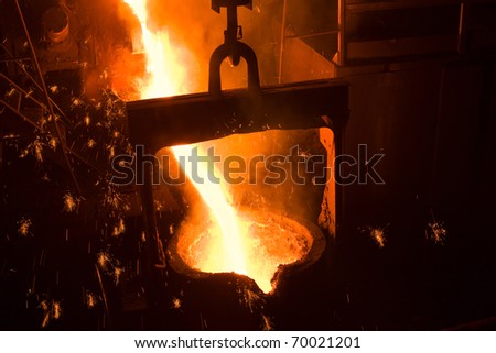 Molten metal poured from lathe for iron casting.