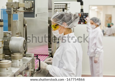 Women working at the pharmaceutical factory. Shallow DOFF. See more images and video from this series.