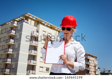 Series of images and video featuring a home, real estate agent, and home owners. Agent showing information for the home sale. Blank paper is great for your text or advertisement
