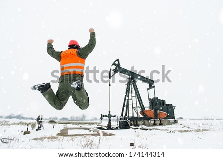 Oil Drill, field pump jack,happy worker jumping for a happiness. See more images and video from this series and Refinery series.
