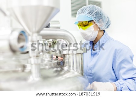 Woman working at the pharmaceutical factory. Shallow DOFF and \'high key\' effect. See more images and video from this series.