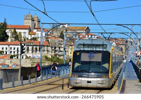 The Porto Metro Train crosses the Dom Luis 1 Bridge over the River Douro. The train is traveling from Vila Nova da Gaia to Porto city, across the River Douro. PORTO, PORTUGAL , MARCH 2015