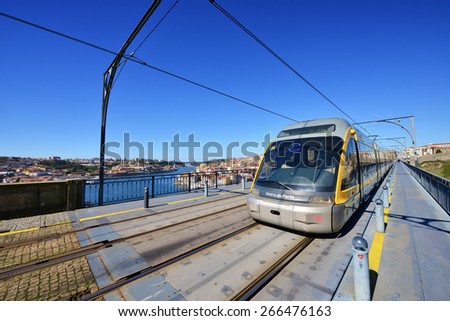 The Porto Metro Train crosses the Dom Luis 1 Bridge over the River Douro. The train is traveling from Vila Nova da Gaia to Porto city, across the River Douro. PORTO, PORTUGAL , MARCH 2015