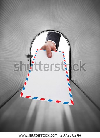Mailman holding a white envelope