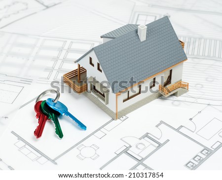 Buying a house\
House on blueprint and keys