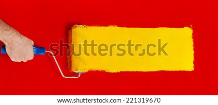 Paint roller Hand with paint roller isolated on white Paint roller Hand with paint roller isolated on white