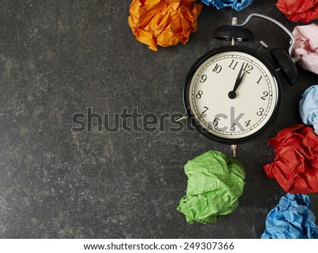 Table clock and paper balls with copyspace