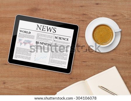 News page on tablet and coffee cup