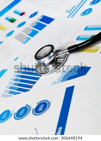 Stethoscope on medical charts papers