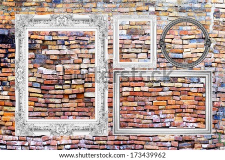 picture frame isolated on old brick wall background.